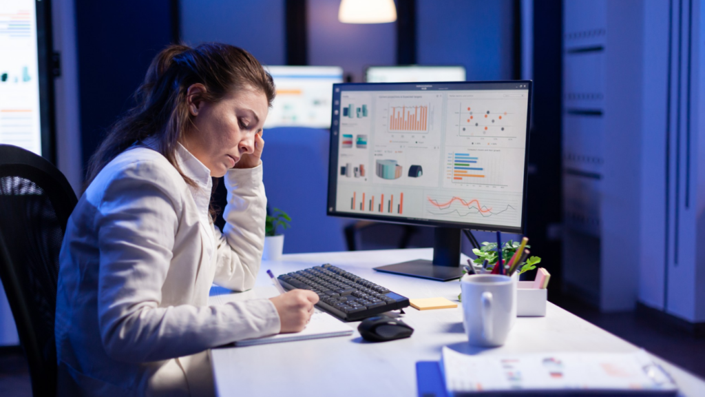 CRM dashboard on laptop showing sales pipeline with colorful stages (leads, contacts, opportunities, closed deals). Modern, professional workspace setting.